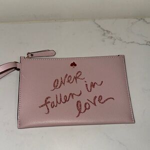 Kate Spade Pink leather Wristlet with glitter font
